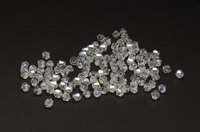 Swarovski crystal AB beads on a black background.