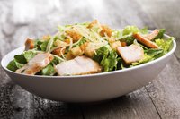 Salad bowl with poached chicken.