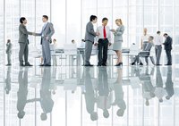 Office space with employees greeting each other