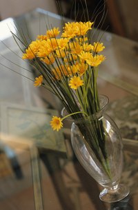 A waterless glass vase is a tip-off that the flowers are fake.