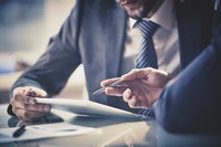 Close-up of two men in business meeting
