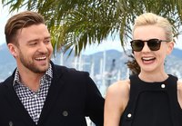 Actor Justin Timberlake and actress Carey Mulligan wearing daytime dressy outfits.