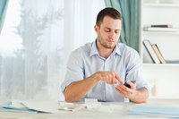 A man is working at his desk.