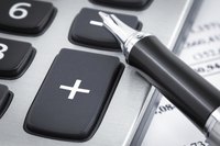 Close-up of pen on calculator