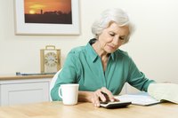 Senior with calculator