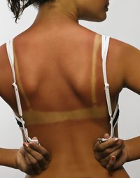 Help prevent sun damage by using self-tanning lotion.
