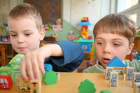 Two boys play at a child care center.