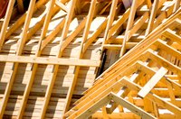 Close-up of exposed wooden planks on a house roof under construction
