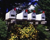 Four mail boxes in a row.