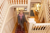 Tighten treads and add carpet to muffle sound and add safety.