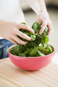 Spinach should be vibrant and green -- never spotted.