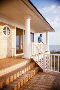 Restoring old painted wooden columns returns a home to its former glory.