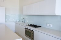 Refurbish old laminate cabinets with a fresh coat of paint.