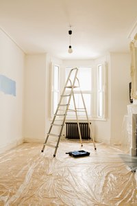 Use a sanding sponge and a new coat of paint to get rid of roller marks in your ceiling.