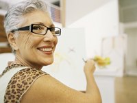 An artist drawing in her art studio.