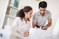 Banking team looking at tablet