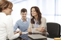 Business owner speaking with company lawyer