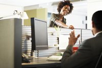 A businesswoman and man are having a discussion.