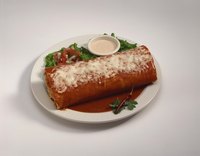 A monster burrito can range from an oversized burrito to a log-style one.