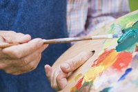 Paint over both the paper mache and the canvas to blend the materials.