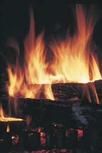 Break up green, or unseasoned, wood to improve its ability to burn.