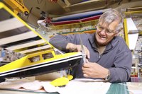 Model airplanes and cars are constructed with plastic and paper.