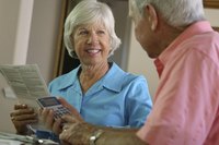 Seniors looking at bills