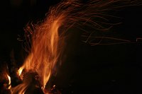 Bonfires are often sites of socialization for friends and family members.