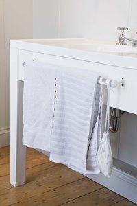 An installed counter top's vanity cannot be solid beneath the drilling area.