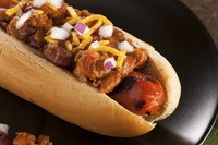 Besides the sauce, a coney dog is traditionally topped with mustard, chopped onion and a sprinkle of grated cheddar cheese