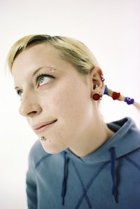 Polymer clay can be used as an inexpensive material to form earrings of multiple sizes while stretching.
