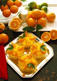 The arrangement of oranges will vary along with the additional types of fruits and vegetables you are serving.