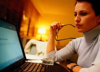 A woman is using a laptop computer.