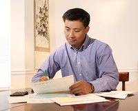Man reviewing business invoice