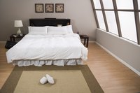 Some upstairs rooms benefit from a layered blend of flooring materials.