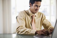 Accounting intern working on a laptop.