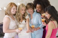 Woman looking at engagement ring at bridal shower.