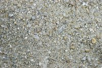 A simple stone or aluminum barrier can help keep gravel out ofyour lawn.