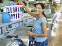Woman doing laudry in a laundrette.
