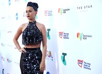 Katy Perry wears a matching pencil skirt and halter top combo.