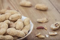 Cracked peanuts on a table.