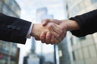 Close-up of two business hands shaking