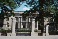 Many decorative front gates are supported by brick or stone columns.