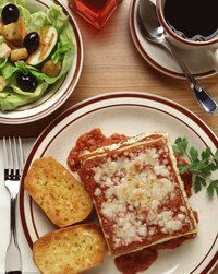 Garlic bread is a traditional accompaniment to lasagna.