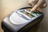 Image of a credit card scanner at a retail store or business.
