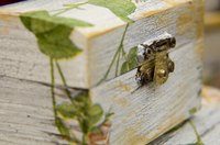 Decoupage is the art of applying cut paper to objects with a paste.