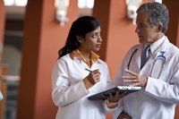A hyperbaric physician consults with a patient’s doctor on an HBO therapy plan.