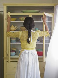 Use pulls to open your kitchen cabinets; touching the cabinet surface can lead to discoloration.