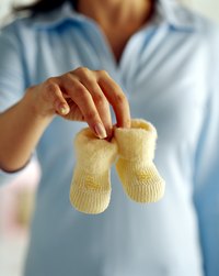Applying icing to marshmallows gives them the appearance of crocheted booties.