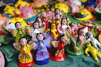 Handmade dolls are among the item sold at a flea market.